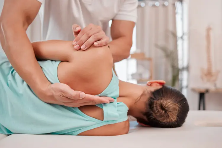 Chiropractor working with a patient at Ascension Health