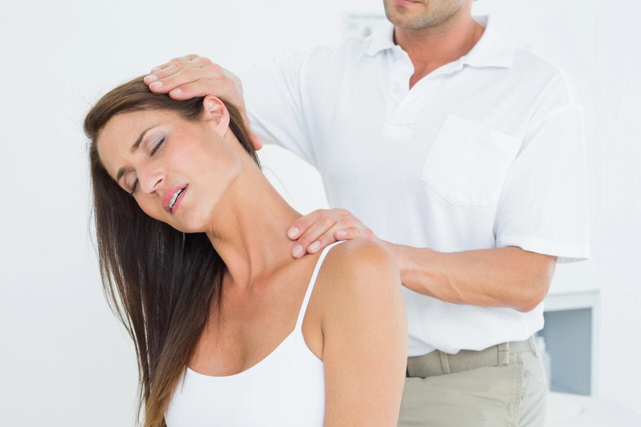 Chiropractor performing a gentle chiropractic adjustment on a patient in Fernley, NV